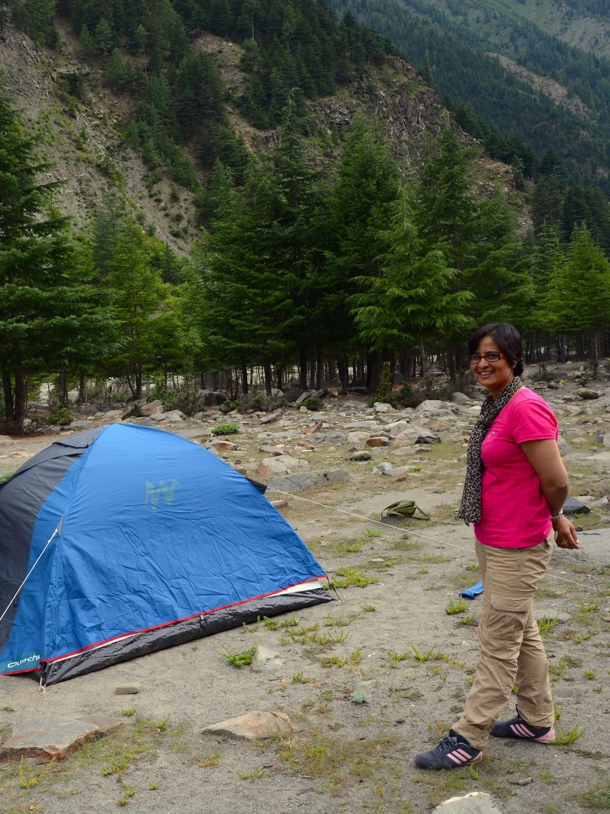 Manu standing beside the tent during camping near Udaipur in Lahaul, Himachal Pradesh